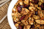 Homemade granola and cranberries on breakfast table